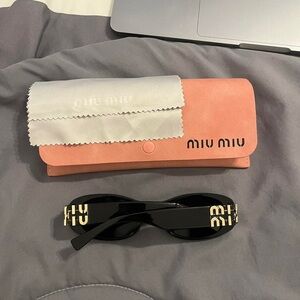 Black Miu Miu sunglasses